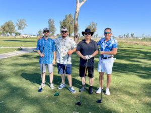 Photo of winning team on the golf course